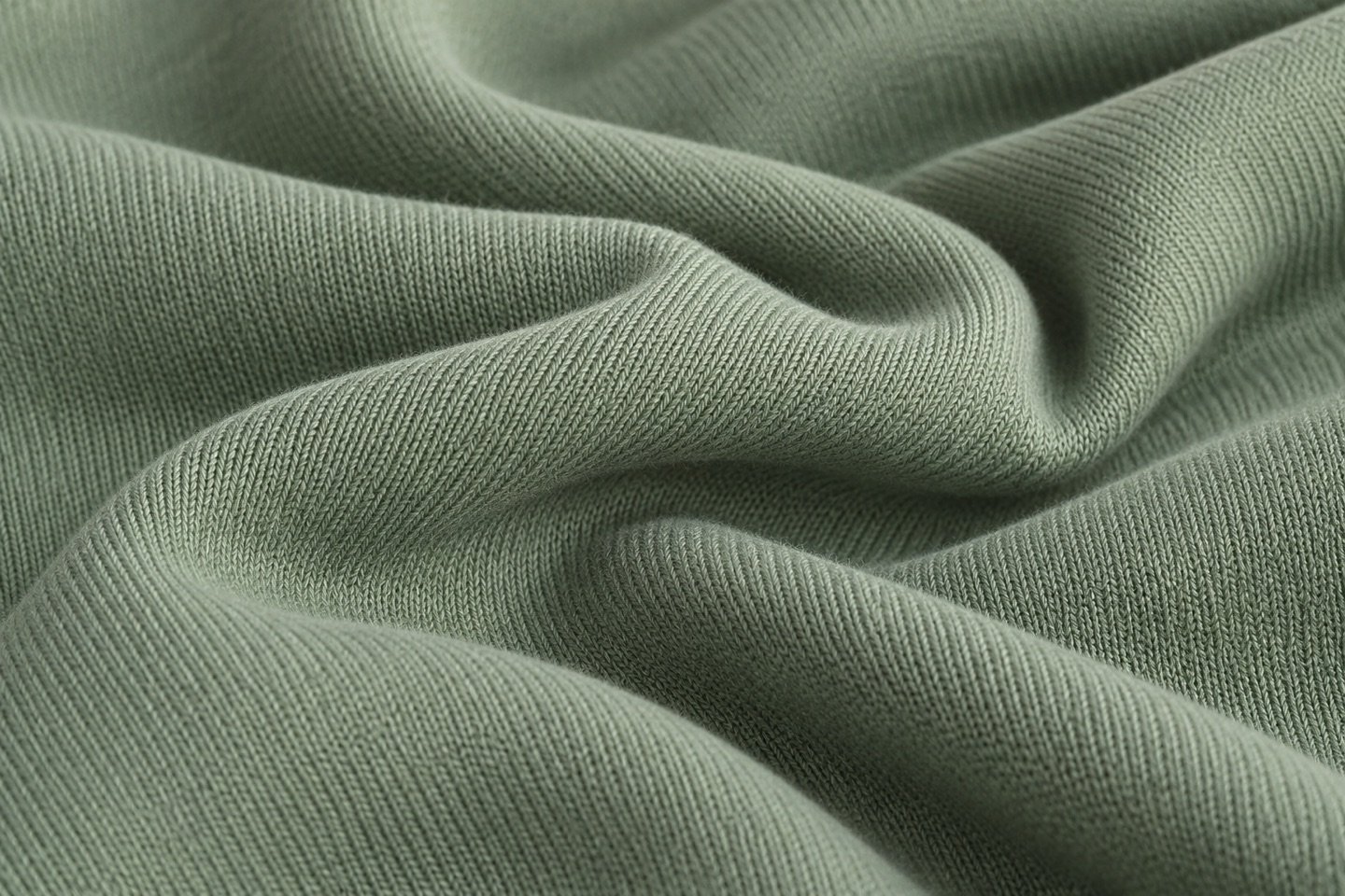 Sage interlock double-knit fabric in soft folds