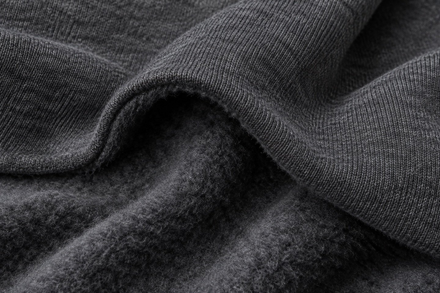 Charcoal three-thread fleece showing a brushed reverse